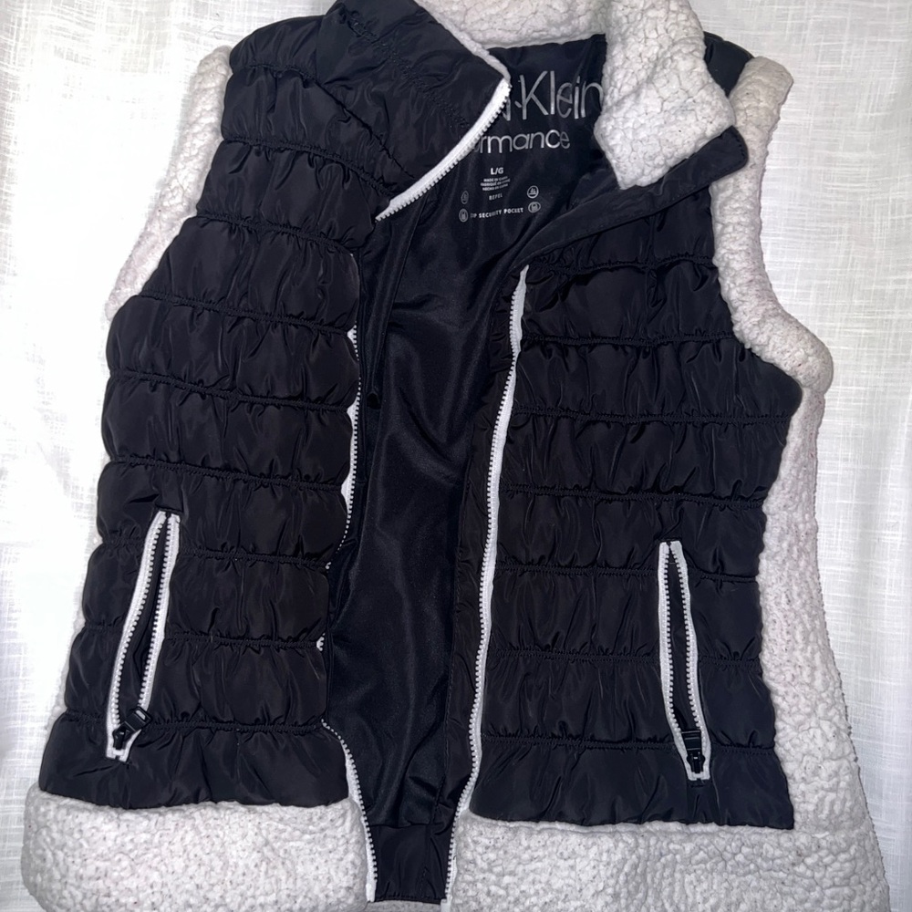 Calvin Klein Performance black and white sherpa puffer vest.